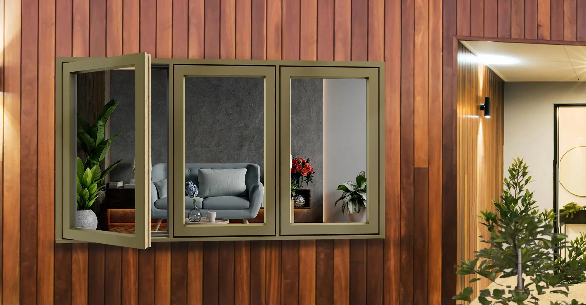 Alu-clad timber window with a bronze finish in a timber clad wall