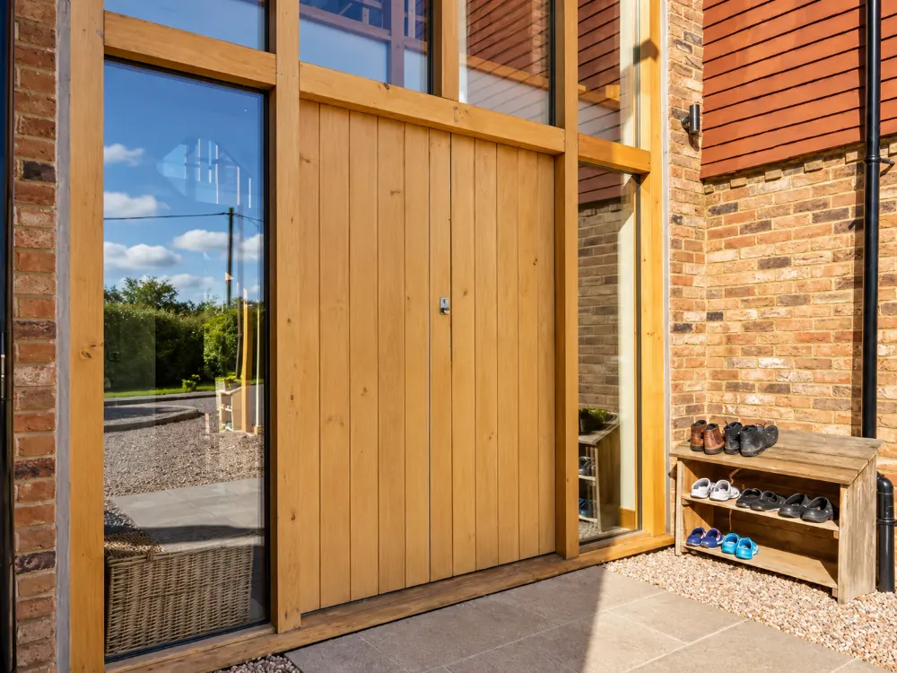 Oak front door set into a glazed oak frame, made by Spittlywood